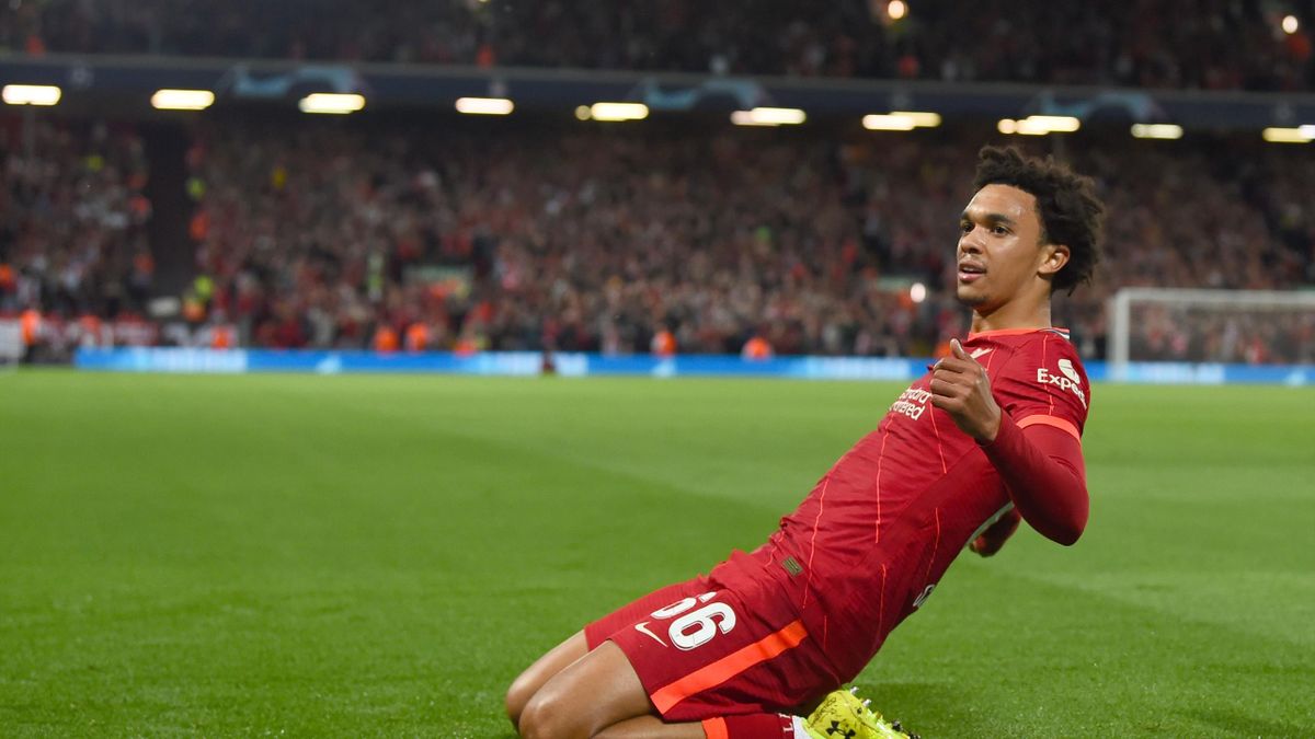 Trent Alexander-Arnold of Liverpool celebrates after scoring the first goal during the UEFA Champions League group B match between Liverpool FC and AC Milan at Anfield on September 15, 2021 in Liverpool, England.
