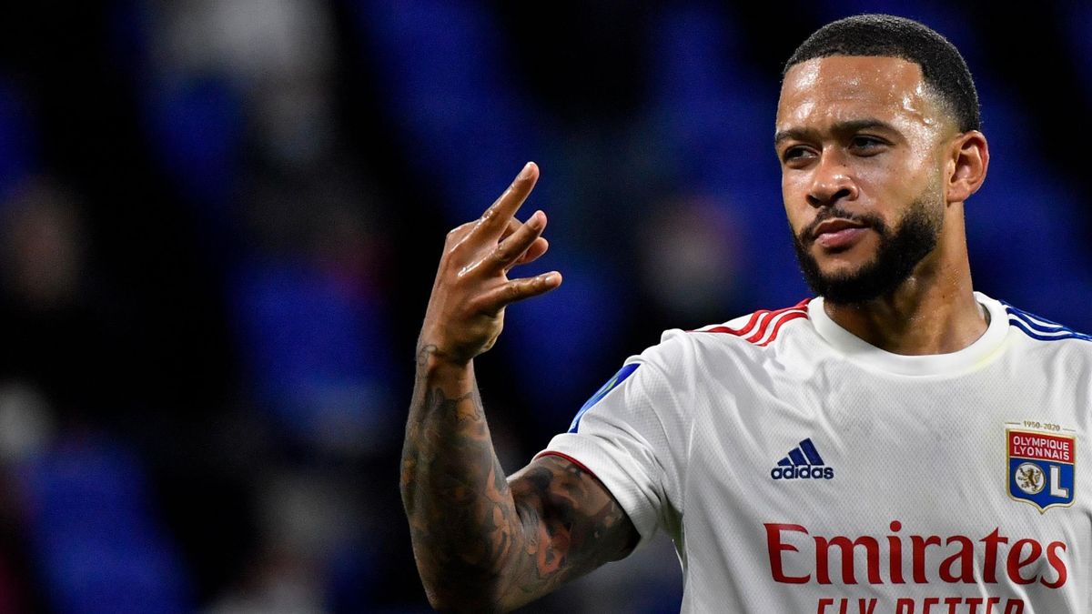 Lyon's Dutch forward Memphis Depay celebrates after scoring a goal during the French L1 footall match between Olympique Lyonnais (OL) and Dijon FC on August 28, 2020, at the Groupama Stadium in Decines-Charpieu, near Lyon, central-eastern France