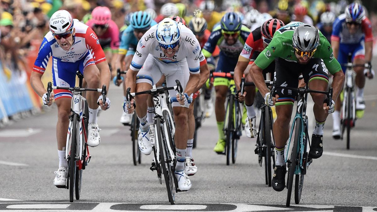 lovakia's Peter Sagan (R), wearing the best sprinter's green jersey, sprints in the last meters to cross the finish line and win, ahead of Norway's Alexander Kristoff (C) and France's Arnaud Demare (L), the 13th stage of the 105th edition of the Tour de F