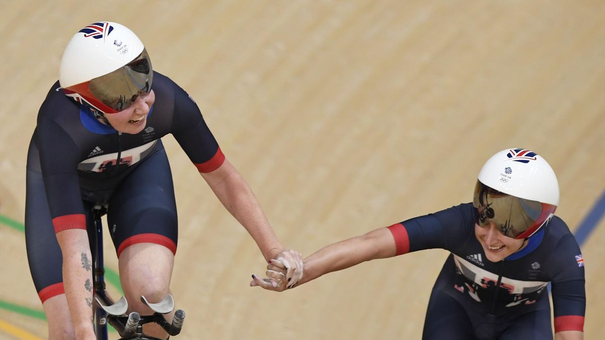 Britain's Laura Trott (R) and Britain's Katie Archibald celebrate after breaking a world record during the women's Team Pursuit qualifying track cycling event at the Velodrome during the Rio 2016 Olympic Games in Rio de Janeiro on August 11, 2016.
