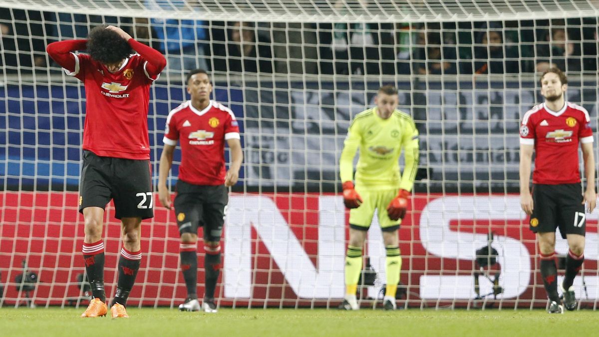 Manchester United players look dejected after Naldo scored the third goal for Wolfsburg