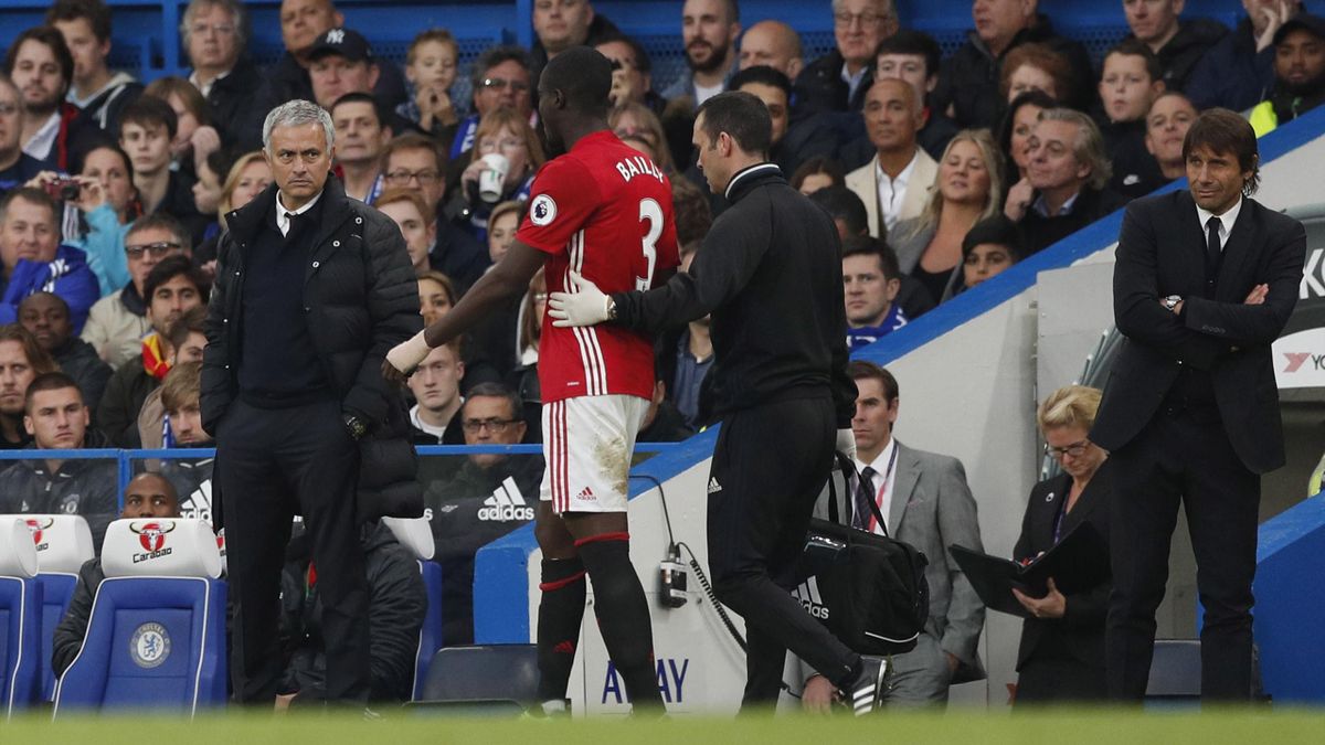 Manchester United manager Jose Mourinho looks at Eric Bailly as he comes off injured
