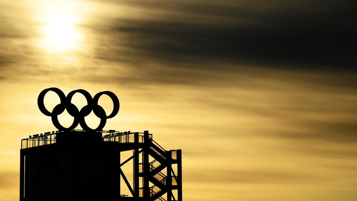 The Olympic Rings logo are seen on the top of a tower as the sun rises prior to the Women's Freestyle Skiing Freeski Big Air Qualification on Day 3 of the Beijing 2022 Winter Olympic Games at Big Air Shougang on February 07, 2022 in Beijing, China