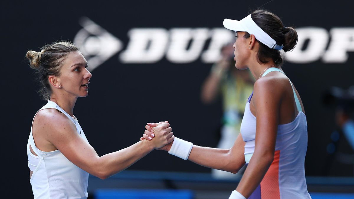 Garbine Muguruza of Spain shakes hands with Simona Halep of Romania after their Women's Singles Semifinal match on day eleven of the 2020 Australian Open at Melbourne Park on January 30, 2020