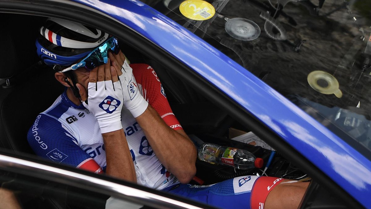 France's Thibaut Pinot, in his team car, reacts after quitting the Tour during the nineteenth stage of the 106th edition of the Tour de France