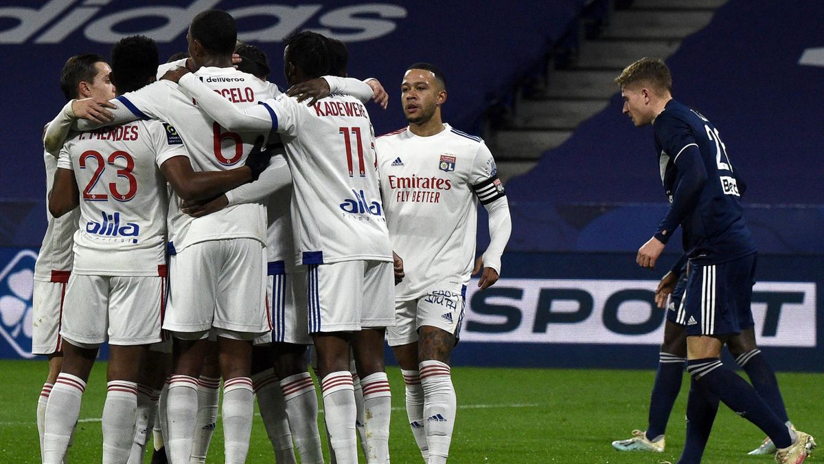 Lyon's players celebrates after scoring during the French L1 football match between Lyon (OL) and Girondins de Bordeaux (FCGB), at the Groupama stadium in Decine-Charpieu, near Lyon, on January 29, 2021