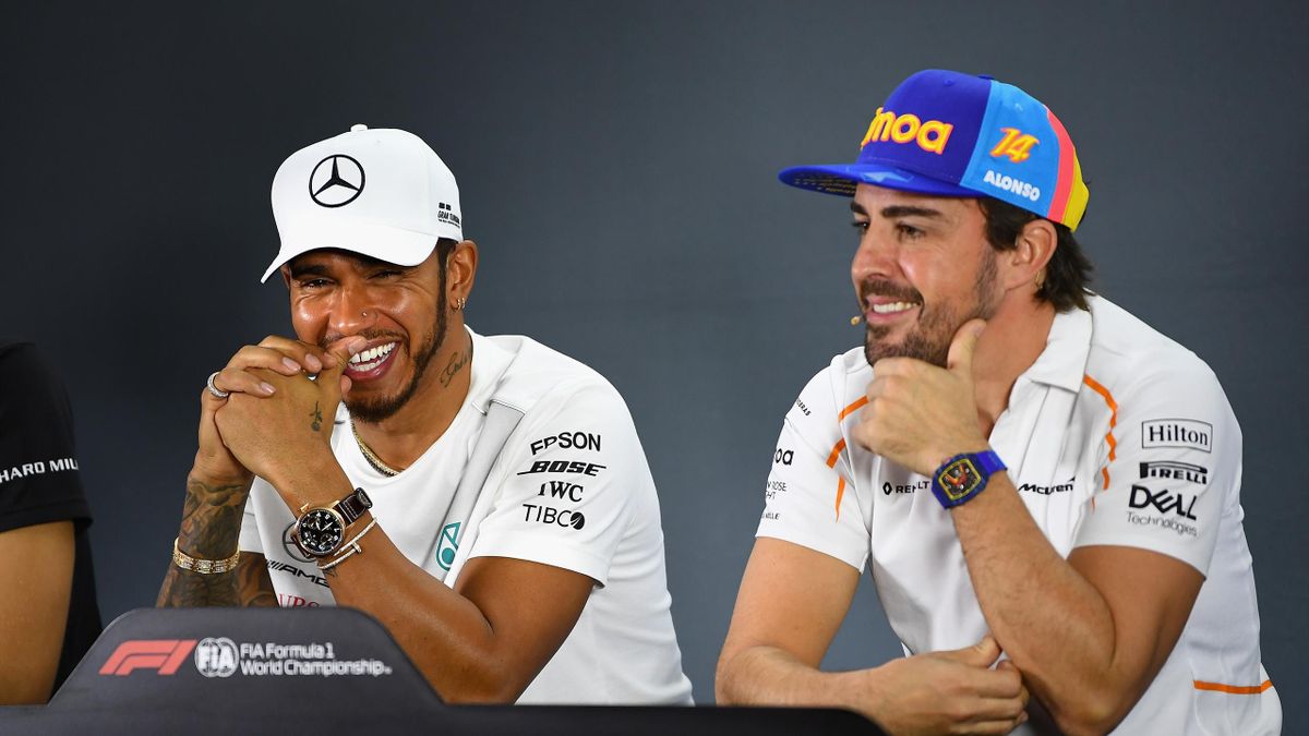 Lewis Hamilton of Great Britain and Mercedes GP and Fernando Alonso of Spain and McLaren F1 talk in the Drivers Press Conference during previews ahead of the Abu Dhabi Formula One Grand Prix at Yas Marina Circuit on November 22, 2018.