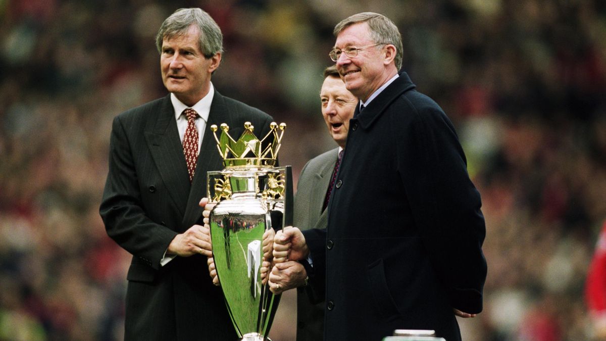 : Manchester United chairman Martin Edwards (left) and manager Alex Ferguson (right) pose with the league title before the FA Barclaycard Premiership match against Sunderland played at Old Trafford