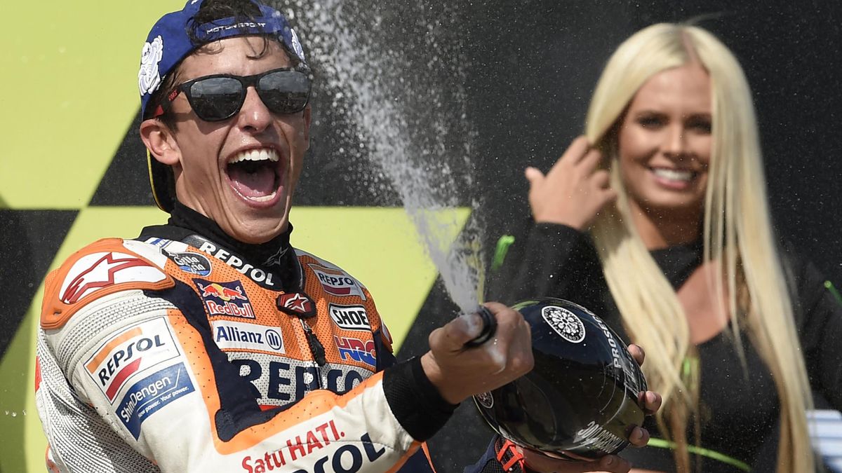 Winner Repsol Honda Team's Spanish rider Marc Marquez celebrates with champagne on the podium of the Moto GP Czech Grand Prix in Brno on August 4, 2019.