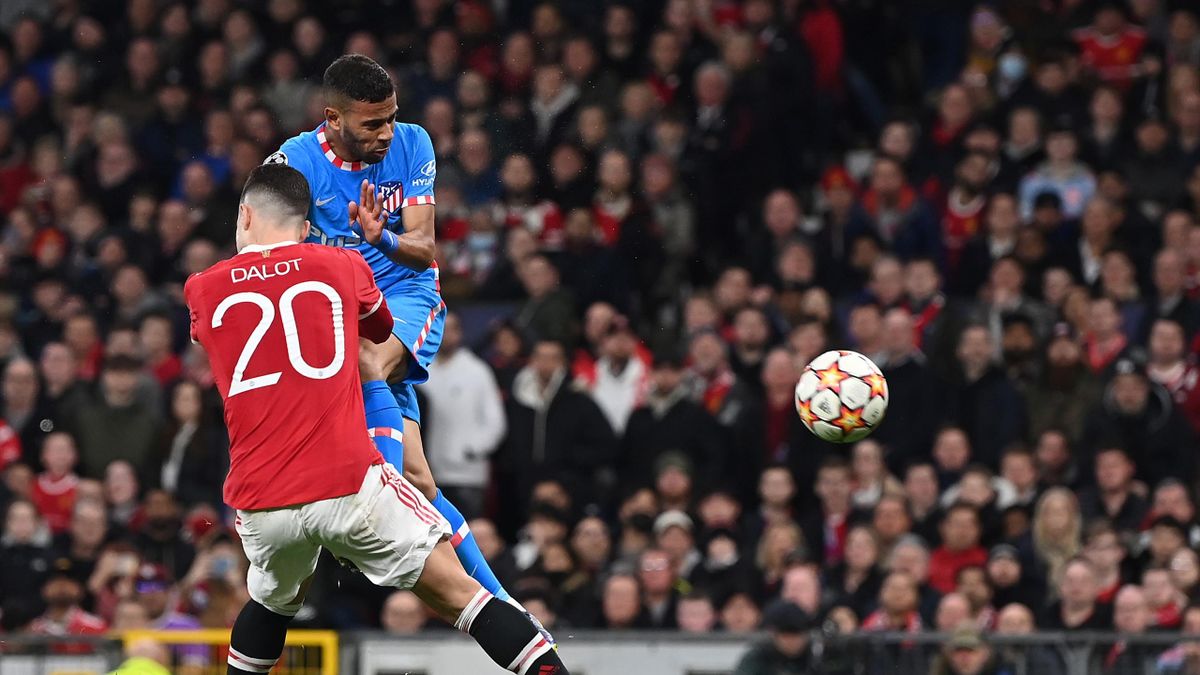 MANCHESTER, ENGLAND - MARCH 15: Renan Lodi of Atletico Madrid scores their team's first goal during the UEFA Champions League Round Of Sixteen Leg Two match between Manchester United and Atletico Madrid at Old Trafford on March 15, 2022 in Manchester, Eng
