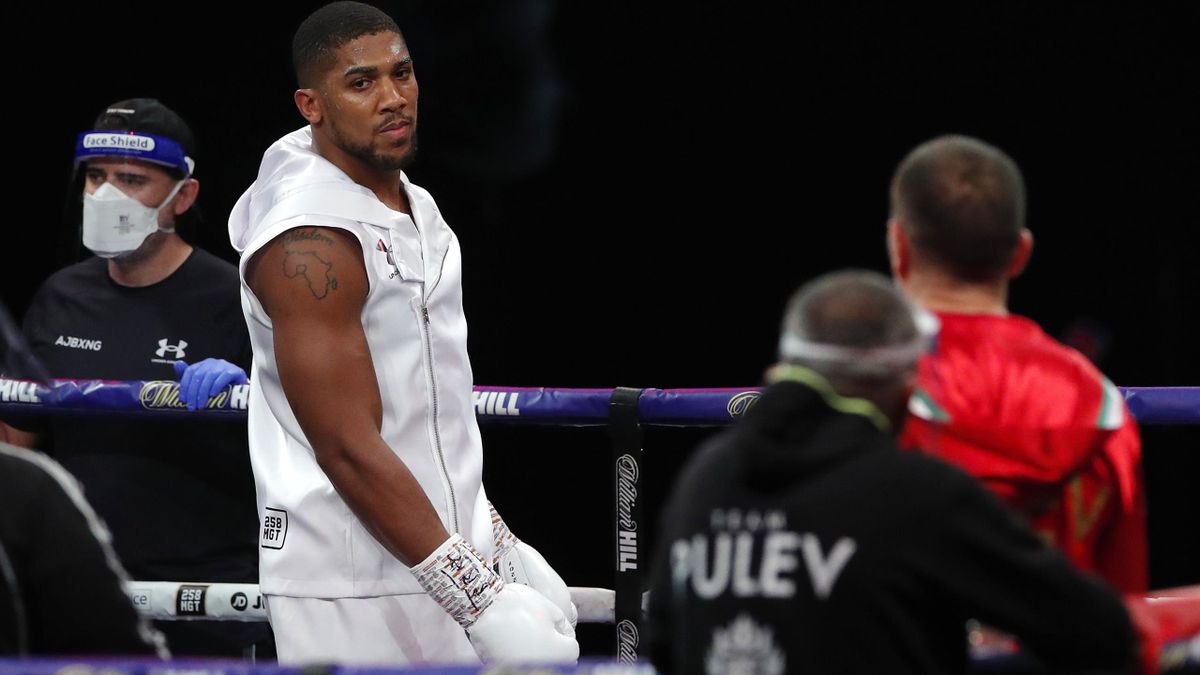 Anthony Joshua stares at Kubrat Pulev prior to the IBF, WBA, WBO and IBO World Heayweight Title fight between Anthony Joshua and Kubrat Pulev at The SSE Arena, Wembley on December 12, 2020 in London, England. A limited number of fans (1000) are welcomed b