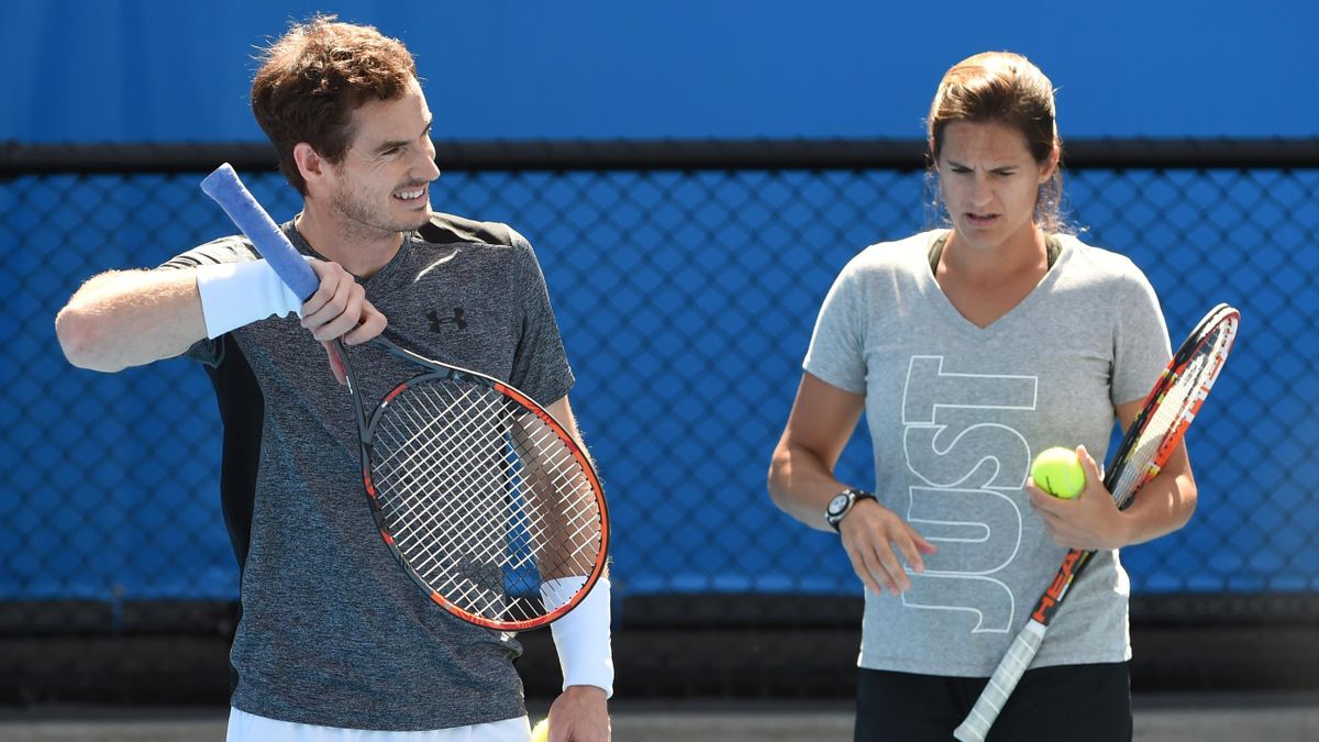 Britain's Andy Murray (L) is watched by his coach Amelie Mauresmo during a training session on day seven of the 2016 Australian Open tennis tournament in Melbourne on January 24, 2016.
