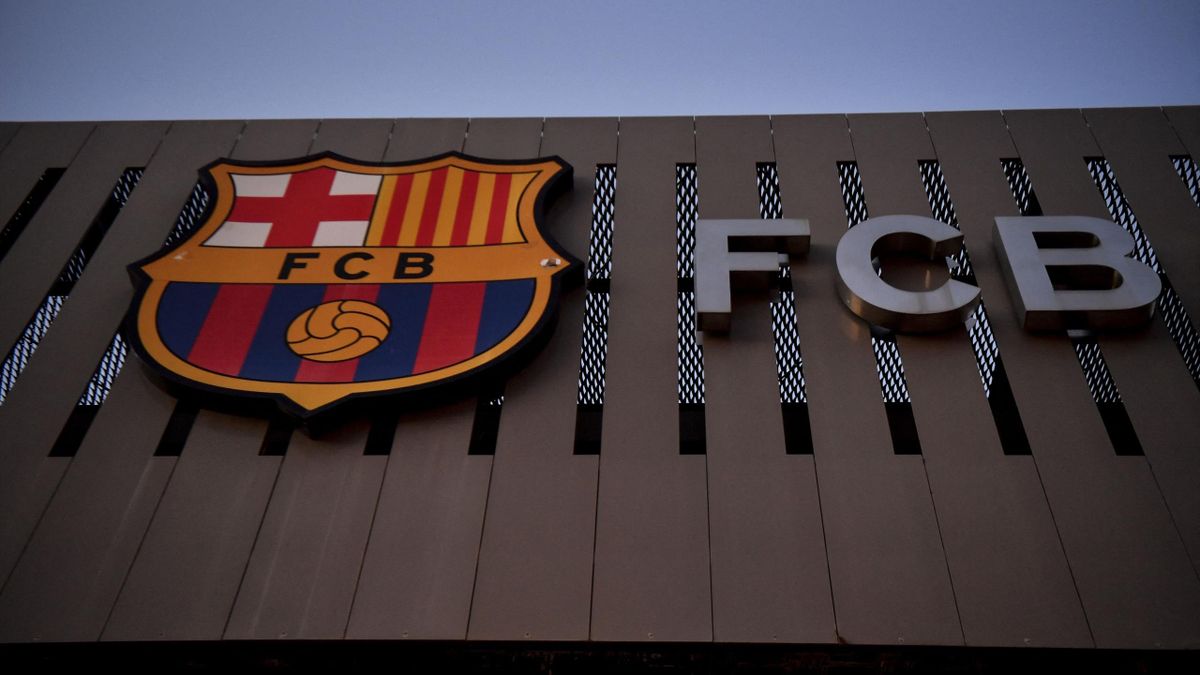 This photograph taken on August 5, 2021 shows the logo of FC Barcelona on the facade of the Camp Nou stadium in Barcelona. - Lionel Messi will end his 20-year career with Barcelona after the Argentine superstar failed to reach agreement on a new deal with