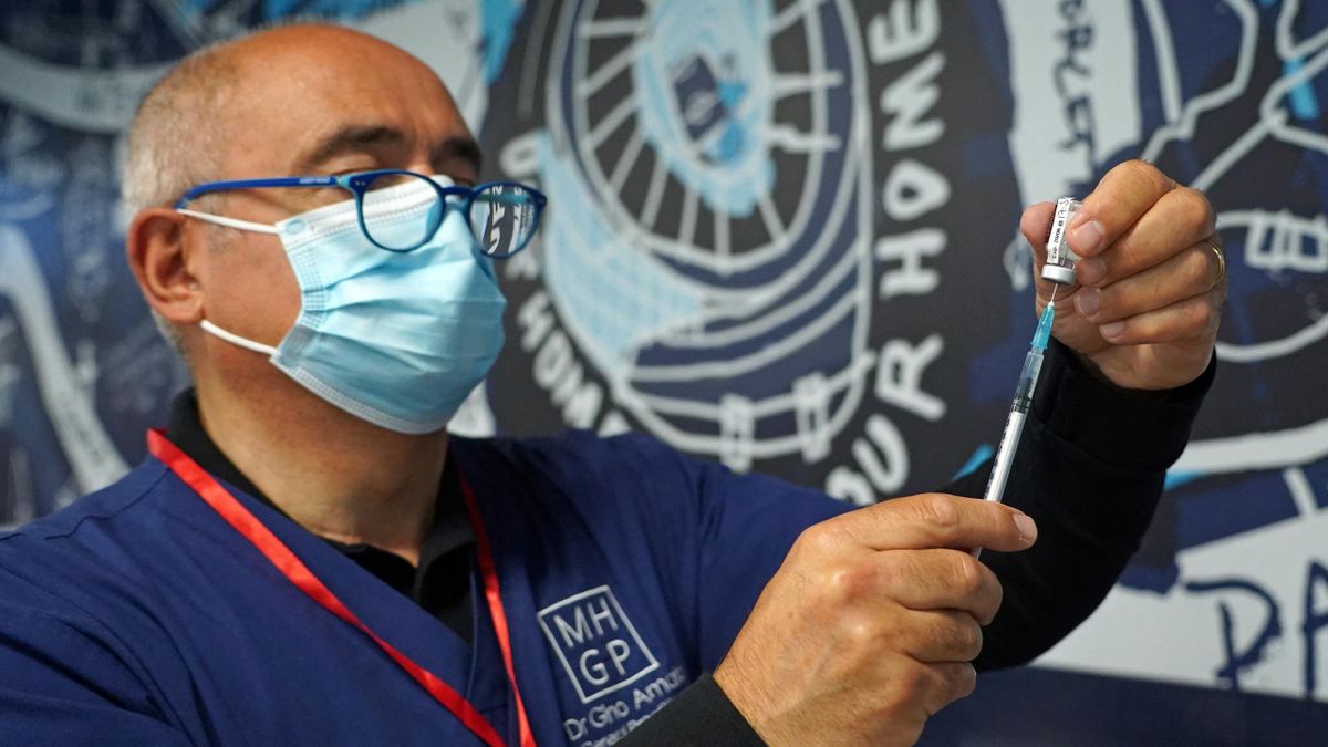 Doctor Gino Amato prepares to administer a dose of the Pfizer/BioNTech covid-19 vaccine at a vaccination centre set up at Premier League club Tottenham Hotspur's football stadium in London on June 20, 2021.