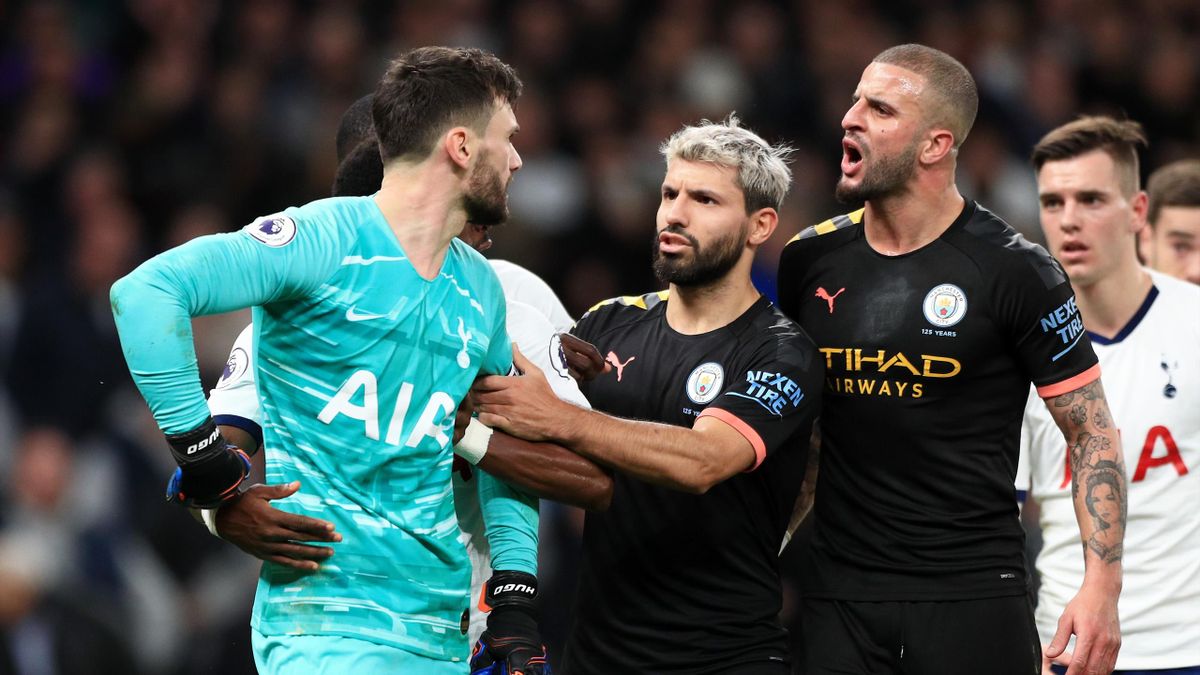 Hugo Lloris of Tottenham Hotspur has a heated exchange with Kyle Walker of Manchester City during the Premier League match between Tottenham Hotspur and Manchester City at Tottenham Hotspur Stadium on February 02, 2020 in London, United Kingdom