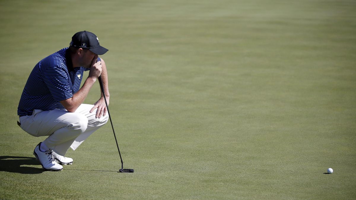 International team member Marc Leishman of Australia studies a putt on the fourth green during the four ball matches of the 2015 Presidents Cup golf tournament in Incheon, South Korea.