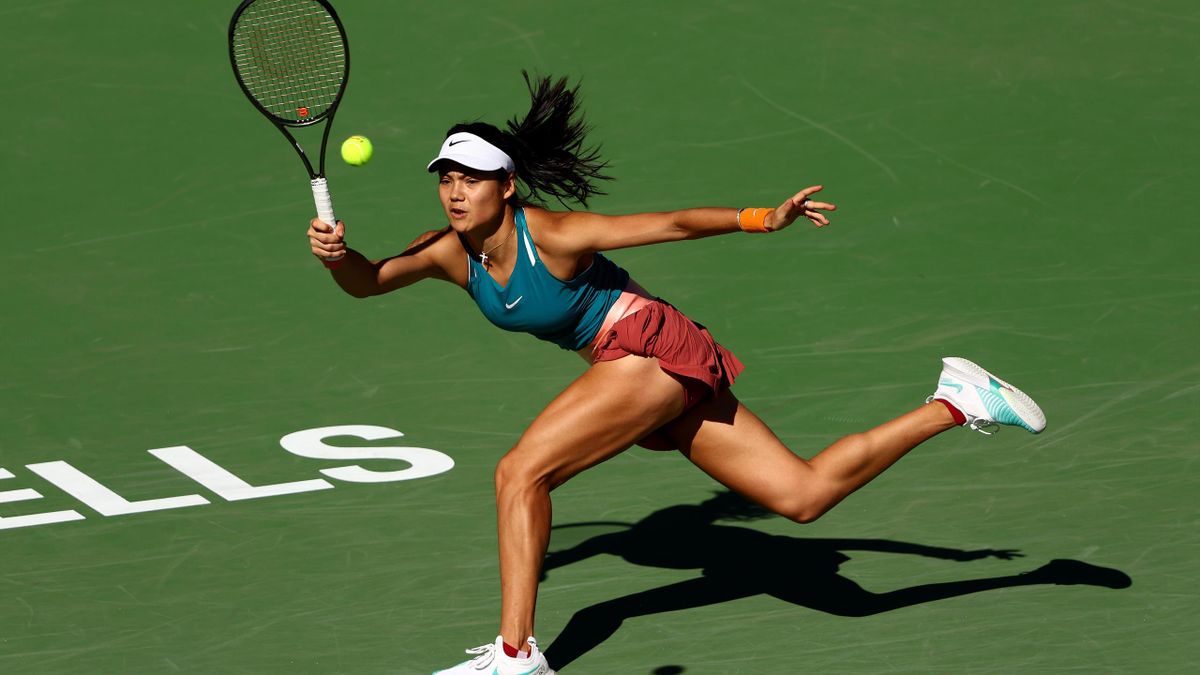 Emma Raducanu of Great Britain plays a forehand against Caroline Garcia of France in their second round match on Day 5 of the BNP Paribas Open