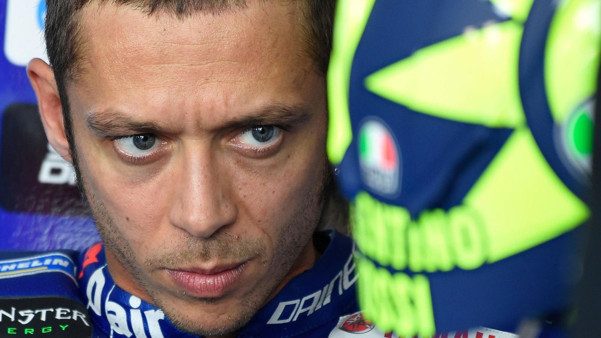 Movistar Yamaha MotoGP's Italian rider Valentino Rossi looks on in the pit during the MotoGP second free practice of the Aragon Grand Prix at the Motorland racetrack in Alcaniz, on September 21, 2018