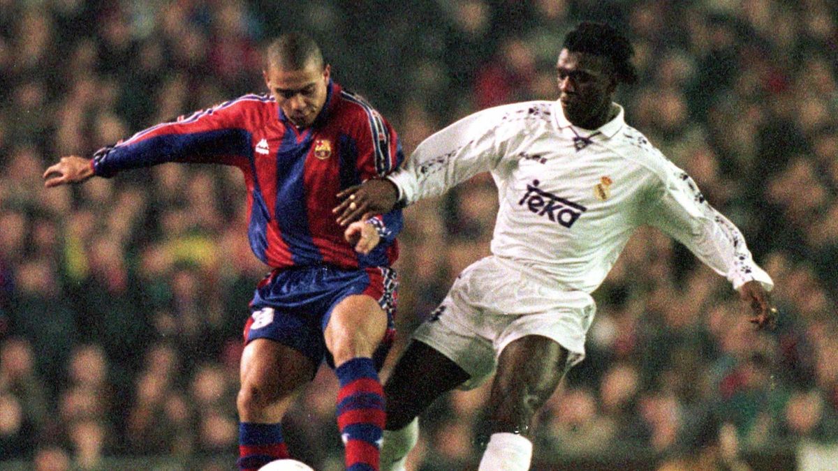 FC Barcelona Brazilian star Ronaldo (L) battles for the ball with Real Madrid Dutch star Clarence Seedorf during their Spanish Cup fourth round first leg soccer match at Camp Nou stadium January 30