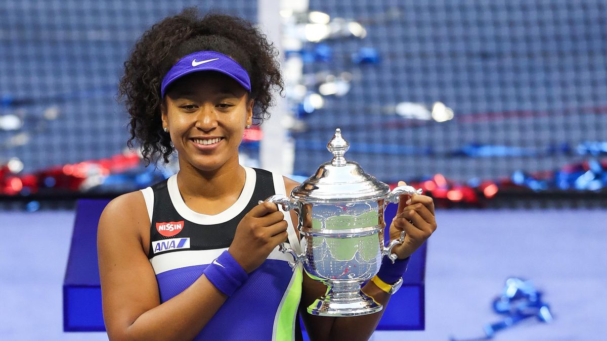 Naomi Osaka of Japan celebrates with the trophy after winning her Women's Singles final match against Victoria Azarenka of Belarus on Day Thirteen of the 2020 US Open at the USTA Billie Jean King National Tennis Center