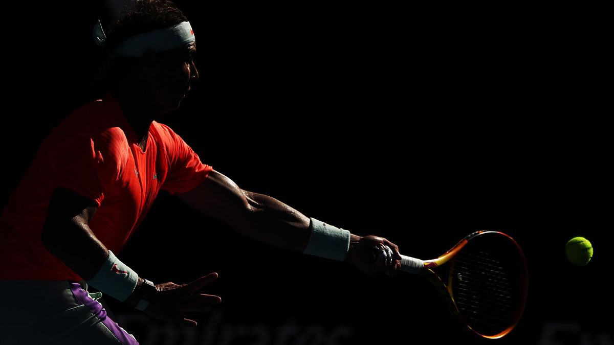 Rafael Nadal of Spain plays a forehand in his Men's Singles first round match against Laslo Djere of Serbia during day two of the 2021 Australian Open at Melbourne Park