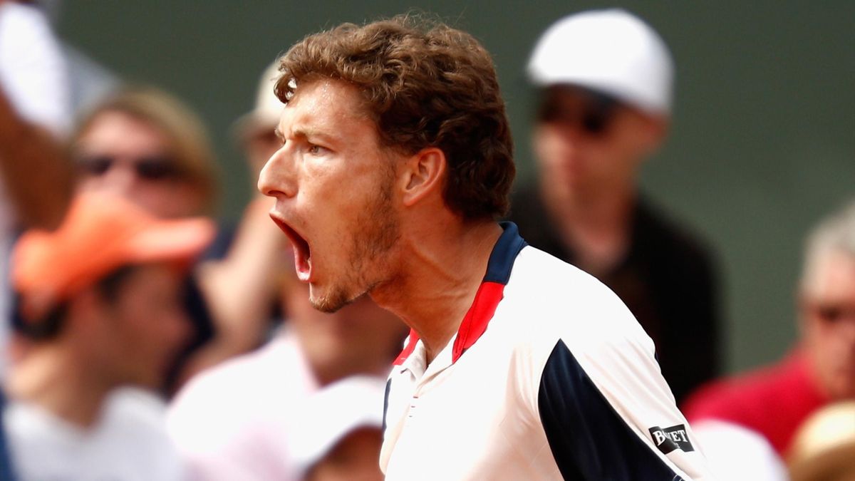 Spain's Pablo Carreno Busta celebrates after winning against Canada's Milos Raonic their tennis match at the Roland Garros 2017 French Open on June 4, 2017 in Paris.