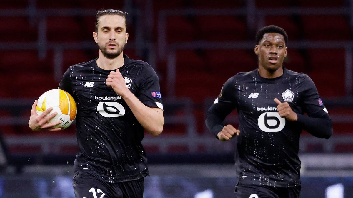 Yusuf Yazici of Lille celebrates 1-1 with Jonathan David of Lille during the UEFA Europa League match between Ajax v Lille at the Johan Cruijff Arena on February 25, 2021 in Amsterdam Netherlands