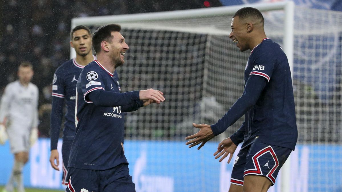 Lionel Messi of PSG celebrates his goal with Kylian Mbappe of PSG during the UEFA Champions League group A match between Paris Saint-Germain (PSG) and Club Brugge KV at Parc des Princes stadium on December 7, 2021 in Paris, France.