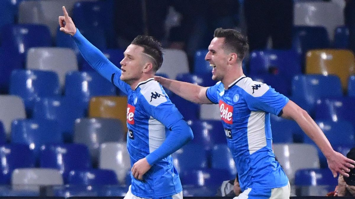 Napoli's Polish defender Piotr Zielinski (C) celebrates after opening the scoring during the Italian Serie A football match Napoli vs Juventus on January 26, 2020 at the San Paolo stadium in Naples