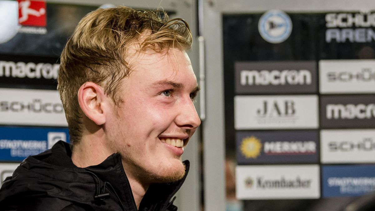 Julian Brandt of Borussia Dortmund is giving an interview after the final whistle during the Bundesliga match between DSC Arminia Bielefeld and Borussia Dortmund