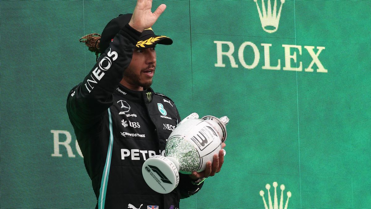 Third placed Mercedes' British driver Lewis Hamilton celebrates on the podium after the Formula One Hungarian Grand Prix at the Hungaroring race track in Mogyorod near Budapest on August 1, 2021.