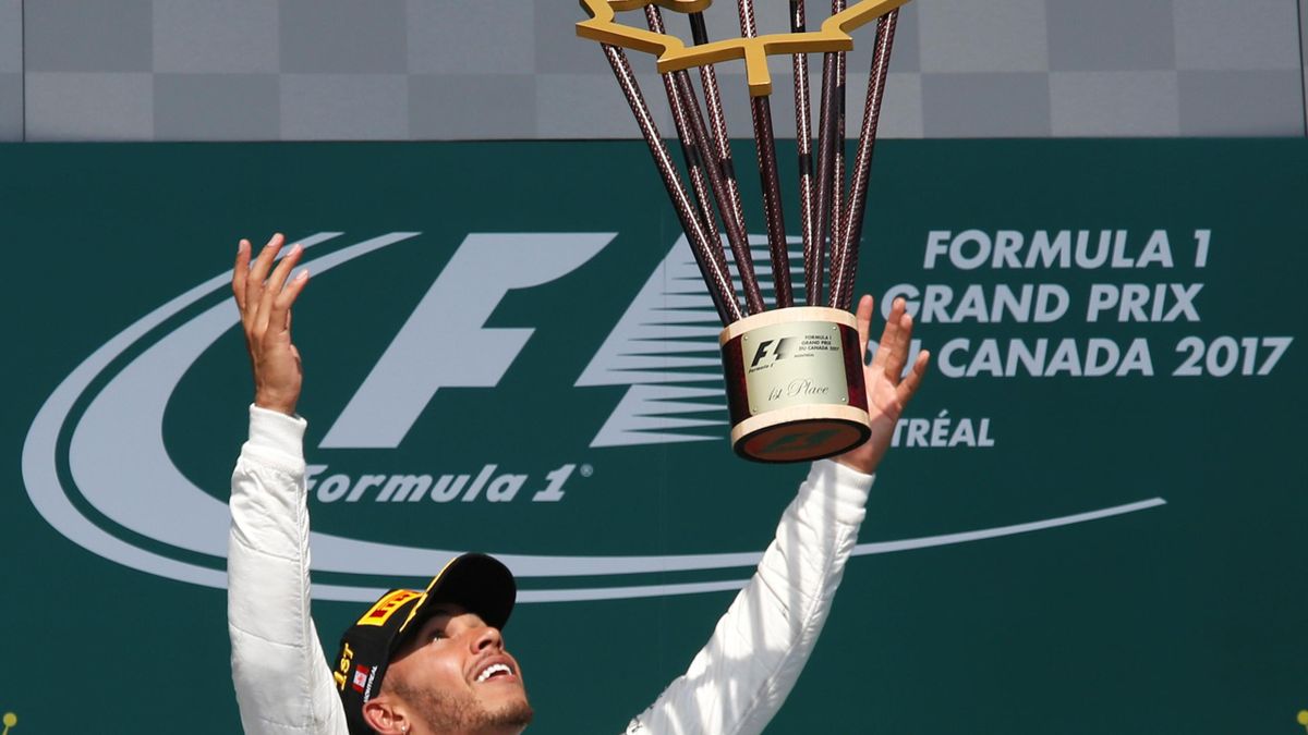 Lewis Hamilton lifts his trophy in Montreal