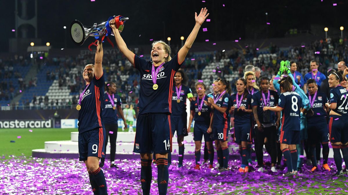 Eugenie Le Sommer and Ada Hegerberg of Lyon celebrate with the trophy during the UEFA Womens Champions League Final between VfL Wolfsburg and Olympique Lyonnais on May 24, 2018 in Kiev, Ukraine.