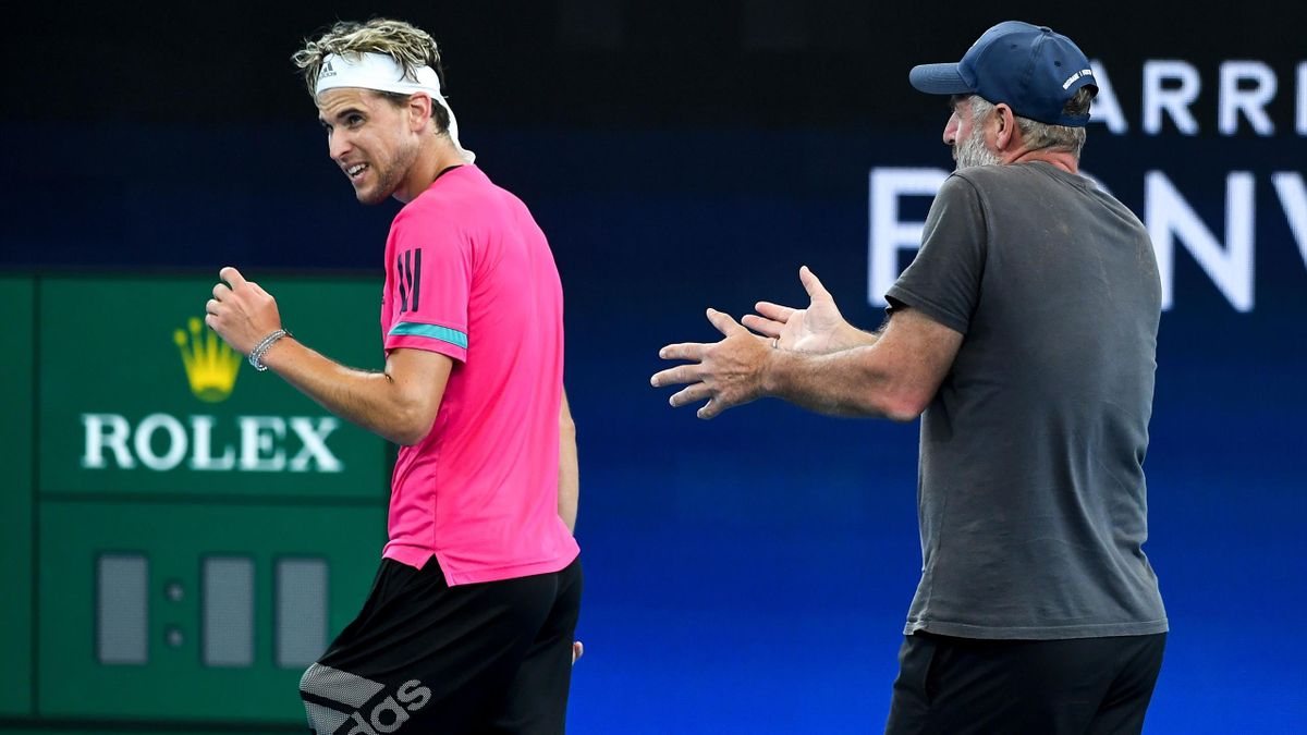 Austria's Dominic Thiem (L) listens to team captain Thomas Muster (R) during a practice session at the Ken Rosewall Arena in Sydney on January 2, 2020