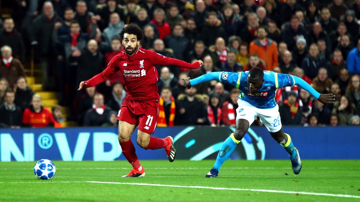 Mohamed Salah of Liverpool evades Kalidou Koulibaly of Napoli during the UEFA Champions League Group C match between Liverpool and SSC Napoli at Anfield on December 11, 2018 in Liverpool, United Kingdom