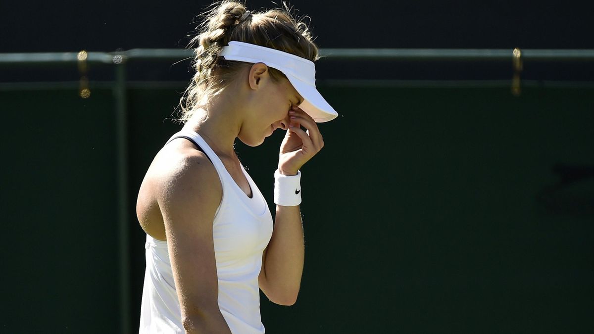 Eugenie Bouchard of Canada holds her head in her hand at Wimbledon