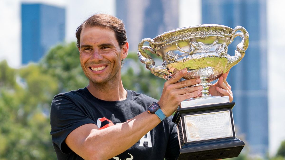 Rafa Nadal hoists aloft his 21st Grand Slam trophy.
