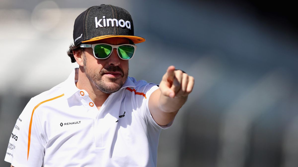 Fernando Alonso of Spain and McLaren F1 points to the crowd on the drivers parad before the Australian Formula One Grand Prix at Albert Park on March 25, 2018 in Melbourne, Australia