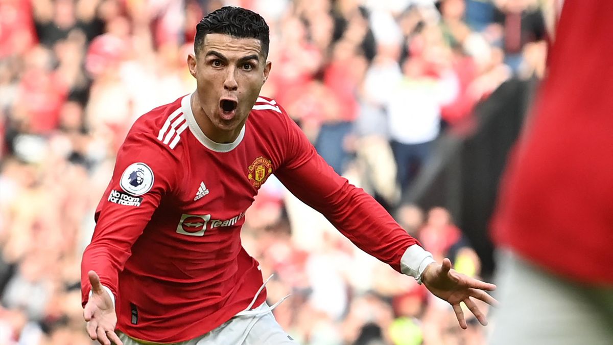 Manchester United's Portuguese striker Cristiano Ronaldo celebrates after scoring his third goal during the English Premier League football match between Manchester United and Norwich City at Old Trafford in Manchester, north west England, on April 16, 20