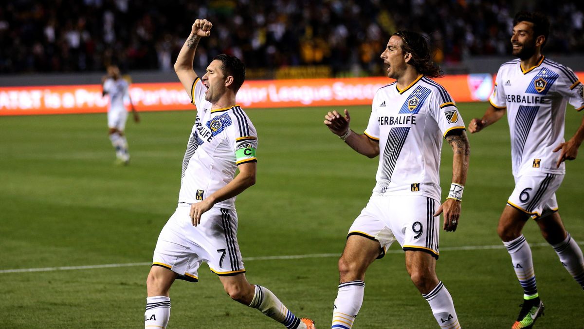 Robbie Keane #7 of the Los Angeles Galaxy celebrates with Alan Gordon #9 and Baggio Husidic #6 after scoring the Galaxy's second goal in the second half against the Chicago Fire at StubHub Center 