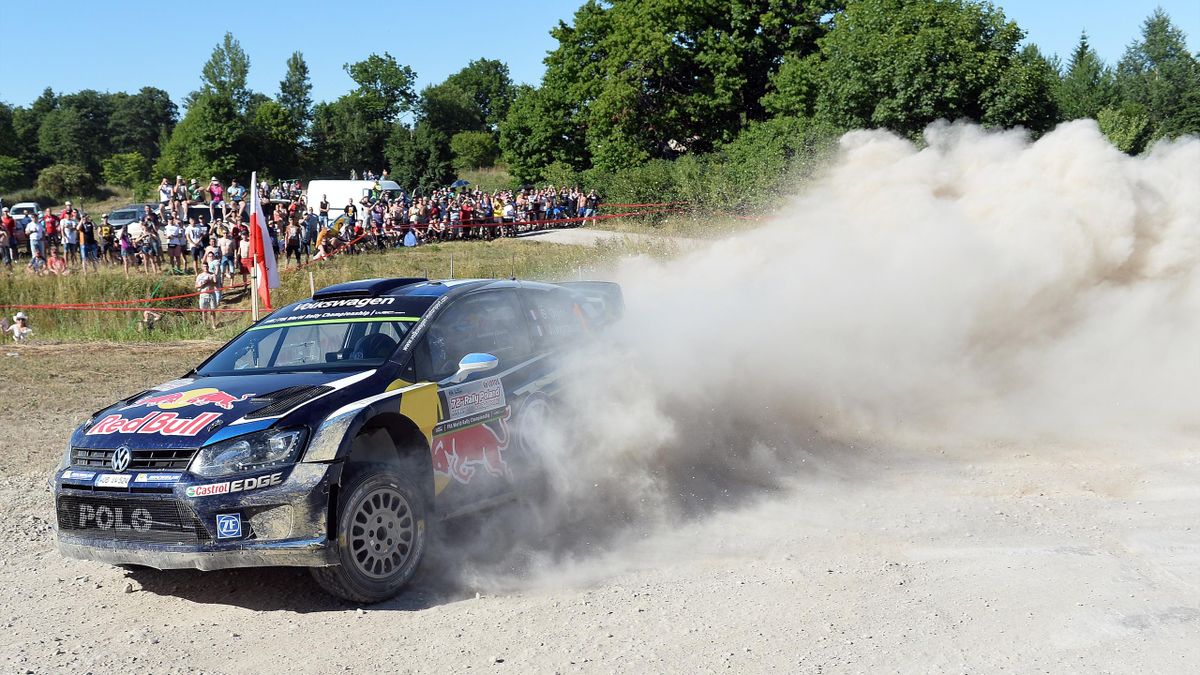 French driver Sebastien Ogier with his co-driver Julien Ingrassia steer their Volkswagen Polo R WRC at Goldap Special Stage during Lotos Rally Poland in Goldap, northeast Poland on July 3, 2015