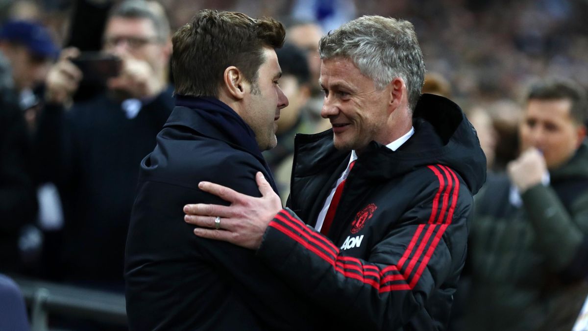 Ole Gunnar Solskjaer, Interim Manager of Manchester United and Mauricio Pochettino, Manager of Tottenham Hotspur shakes hands prior to the Premier League match between Tottenham Hotspur and Manchester United at Wembley Stadium on January 13, 2019 in Londo