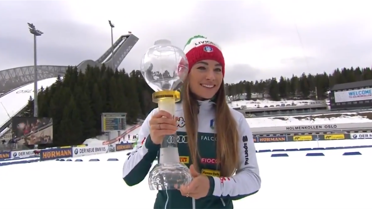Dorothea Wierer celebrates with her Biathlon World Cup Crystal Globe (Credit Biathlon World)