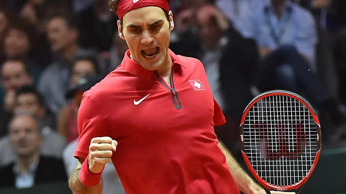Roger Federer celebrates winning the Davis Cup with Switzerland