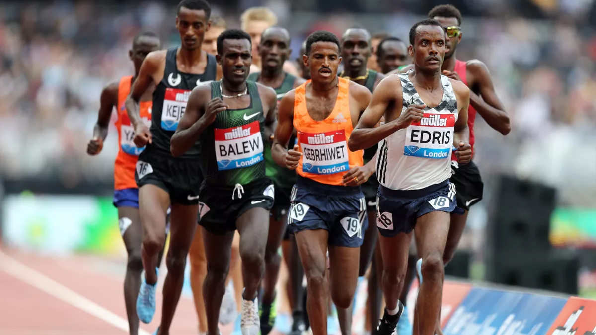 Competitors take part in the Men's 5000m race during Day One of the Muller Anniversary Games at London Stadium on July 21, 2018