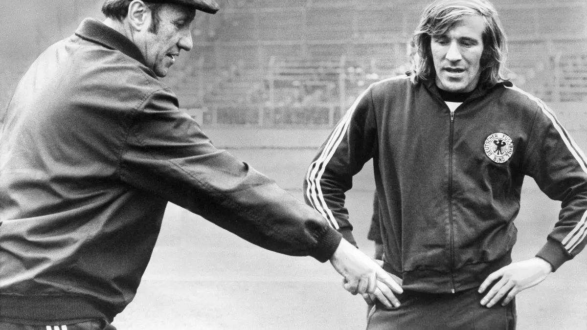 Germany coach Helmut Shon and Gunter Netzer talk strategy