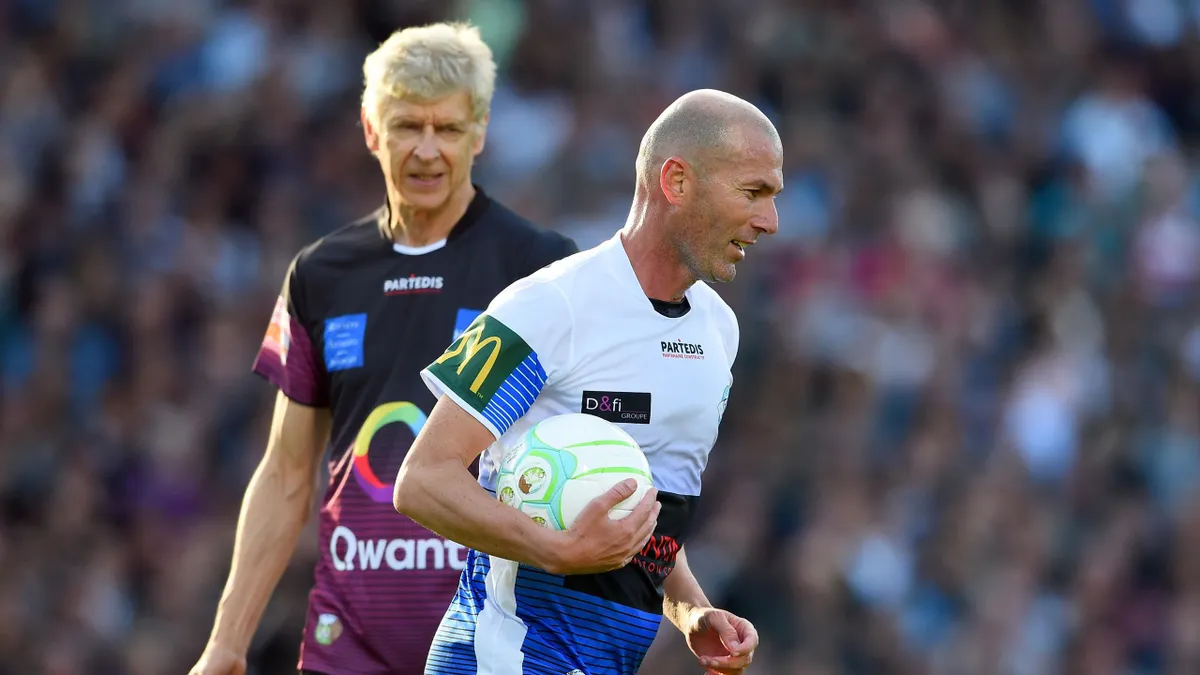 Wenger dribbles past zidane Clearance