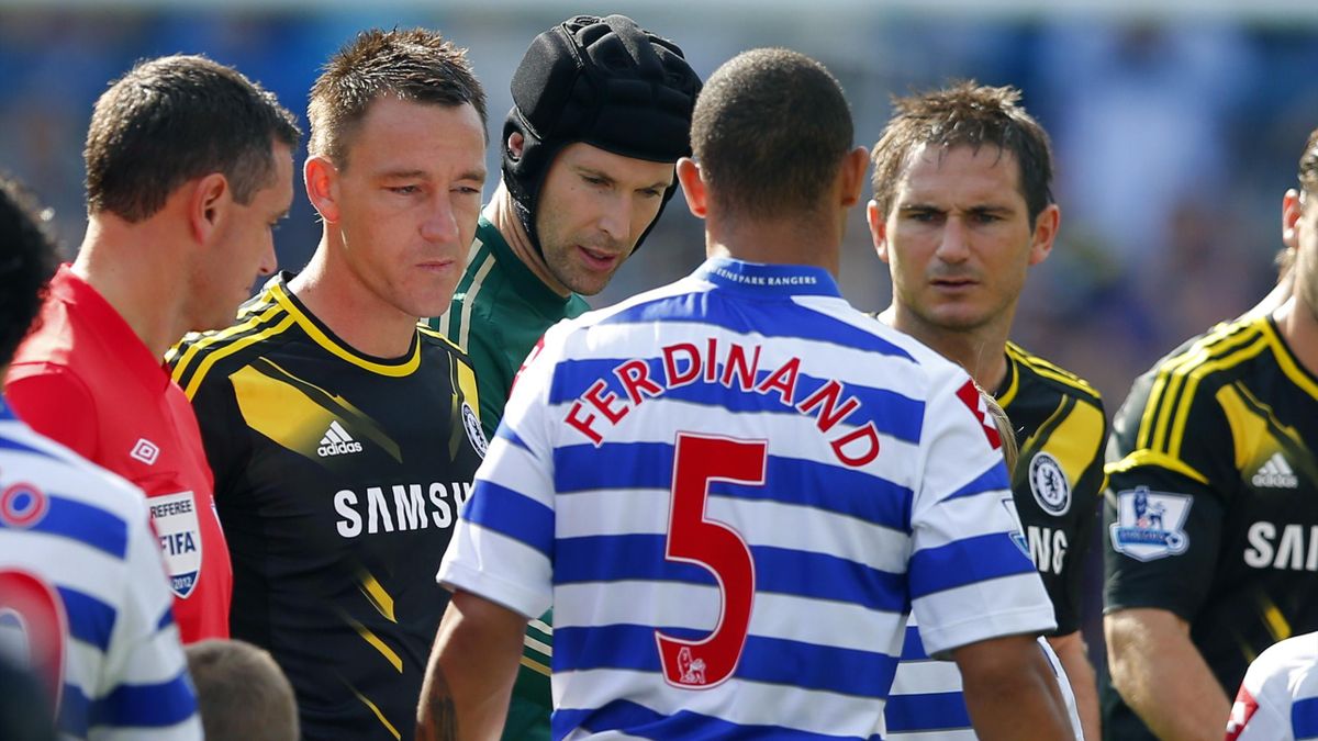 Anton Ferdinand of Queens Park Rangers walks past John Terry (2nd L) of Chelsea without shaking his hand before the start of their English Premier League soccer match at Loftus Road in London, September 15, 2012 (Reuters)