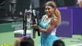 Serena Williams celebrates winning the WTA Finals in 2014