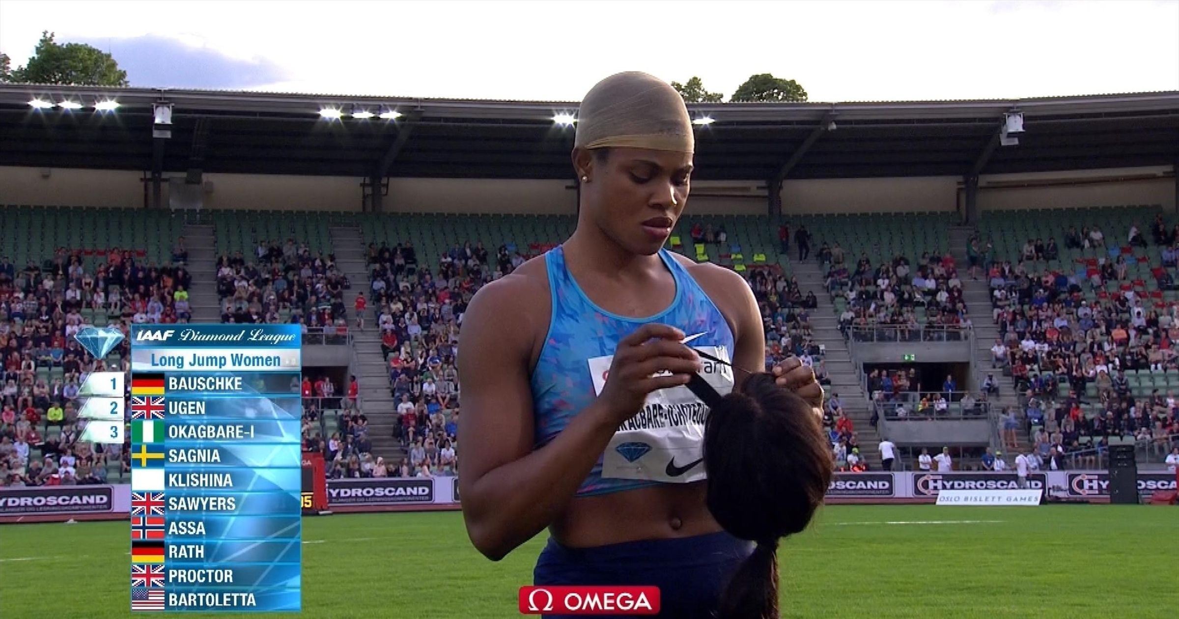 Long jumper Blessing Okagbare s wig falls off on landing Athletics video Eurosport